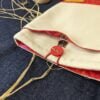 funda para libros tela impermeable talla S forro botón rojo cierre imán